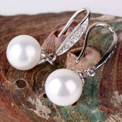 Женские серьги с кисточками серебряного цвета цветком и жемчугом из