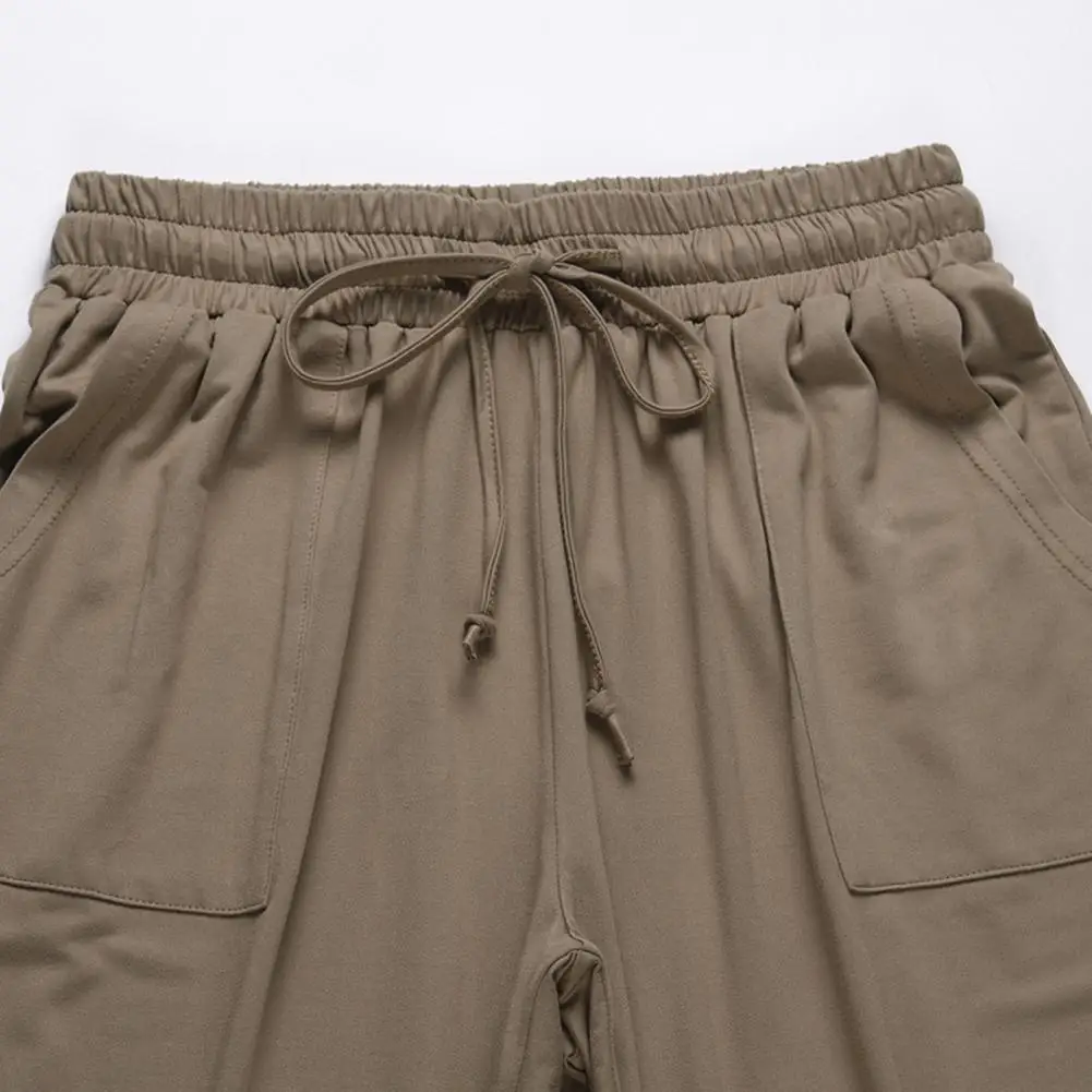 Женский комплект из трех предметов жилет на завязках без рукавов и брюки