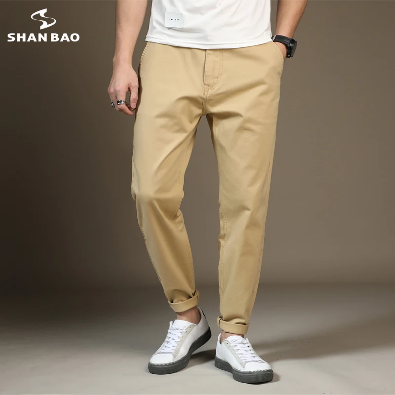 

Осень 2021, брендовые хлопковые Стрейчевые шаровары SHAN BAO, модные однотонные повседневные брюки для молодых мужчин, женские брюки