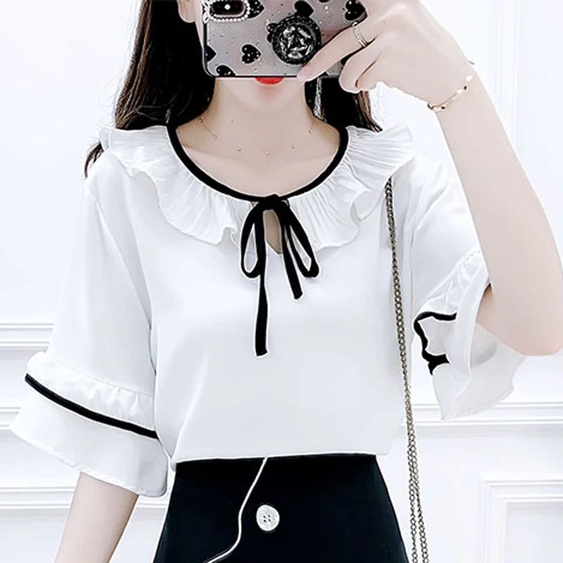 

Women's 2021 summer new small fresh round neck chiffon blouse playful button decoration short skirt two-piece suit