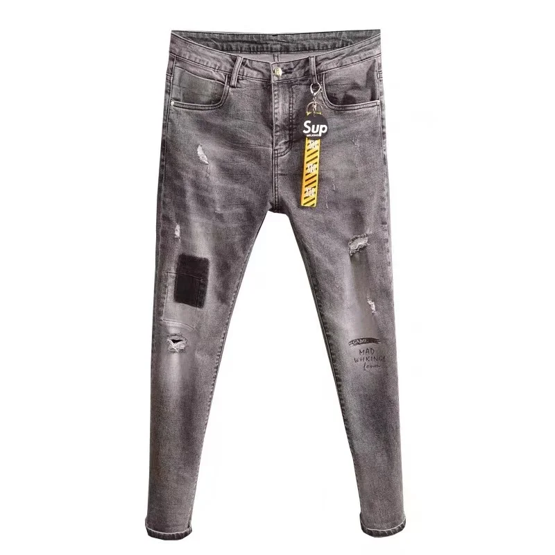Spring and summer smoke gray jeans men's slim small feet elastic fashion ripped holes to show thin skinny pants