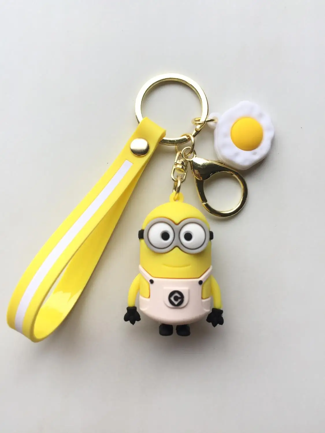 

New High Quality Cute Lovely Cartoon Miniature Keychains Toys Small Yellow Man Keychain Figures Furnishing Best Christmas Gift