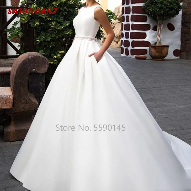 

Женское свадебное платье со шлейфом, без рукавов и с карманами