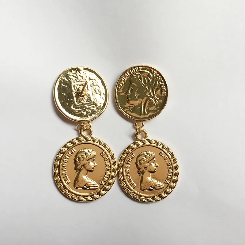 Золотые серьги гвоздики новые винтажные женские с монетами в виде головы