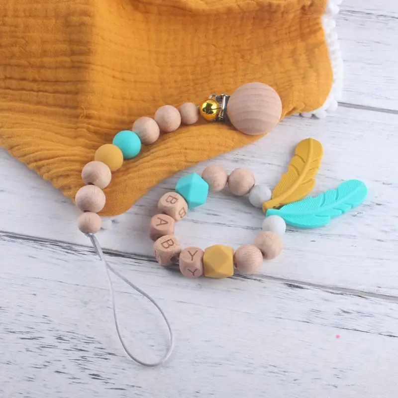 

2Pcs/set Newborn Baby Pacifier Clip Chain Feather Molar Bracelet Set Holder Teethers Infant Toddlers Teething Soother Toys