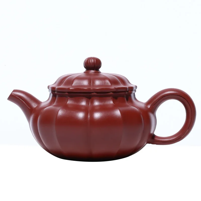 

Antique purple clay teapot with rib pattern