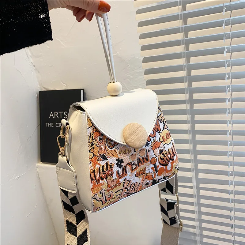 

Simple bag female. 2021 new fashion zongzi bag. online celebrity shoulder messenger bag. personalized graffiti handbag