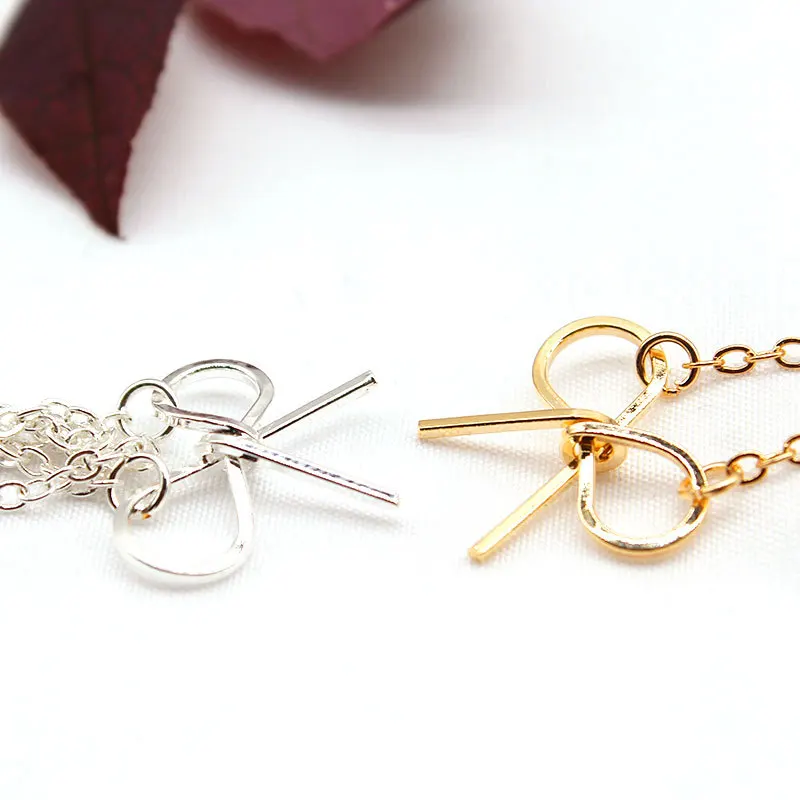 Простое изысканное ожерелье с кулоном в форме банта золотого цвета Длинная