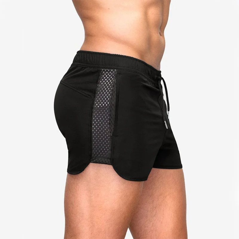 

2021 New Summer Breathable Quick Drying Elastic Mesh Shorts European and American Fitness Training Sprint Six Color Shorts Men