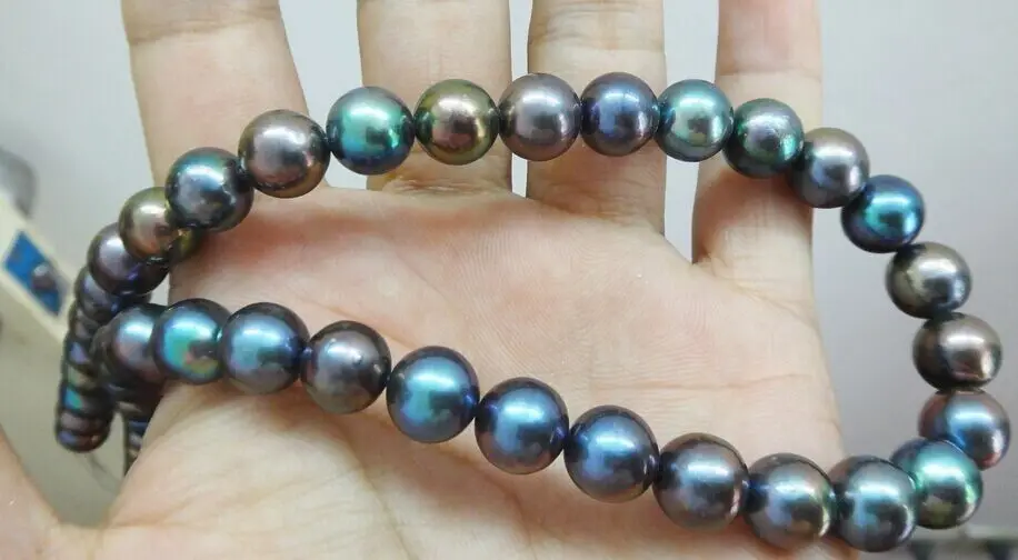 

Superb 18"10-11mm Natural Tahitian genuine black peacock round pearl necklace