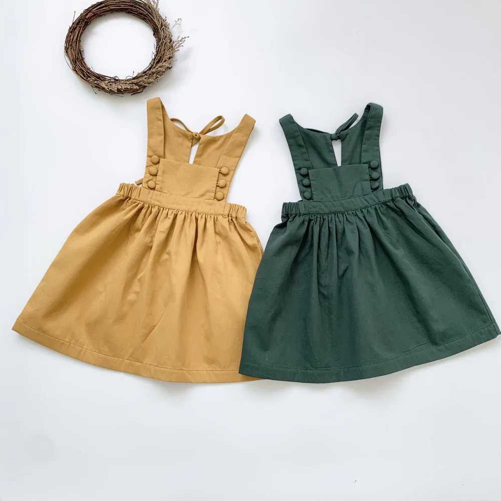 

Girls Dress Spring Fall European and American Style Solid Jumper Vest Dress Toddler Baby Girls Clothing with Buttons Bow 2-7Y