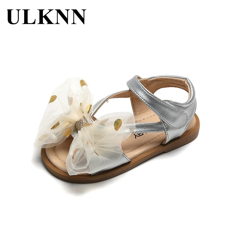 

Школьные сандалии ULKNN с бантом для девочек, Новинка лета 2021, детская повседневная обувь, дышащие кожаные сандалии с открытым носком и шелков...
