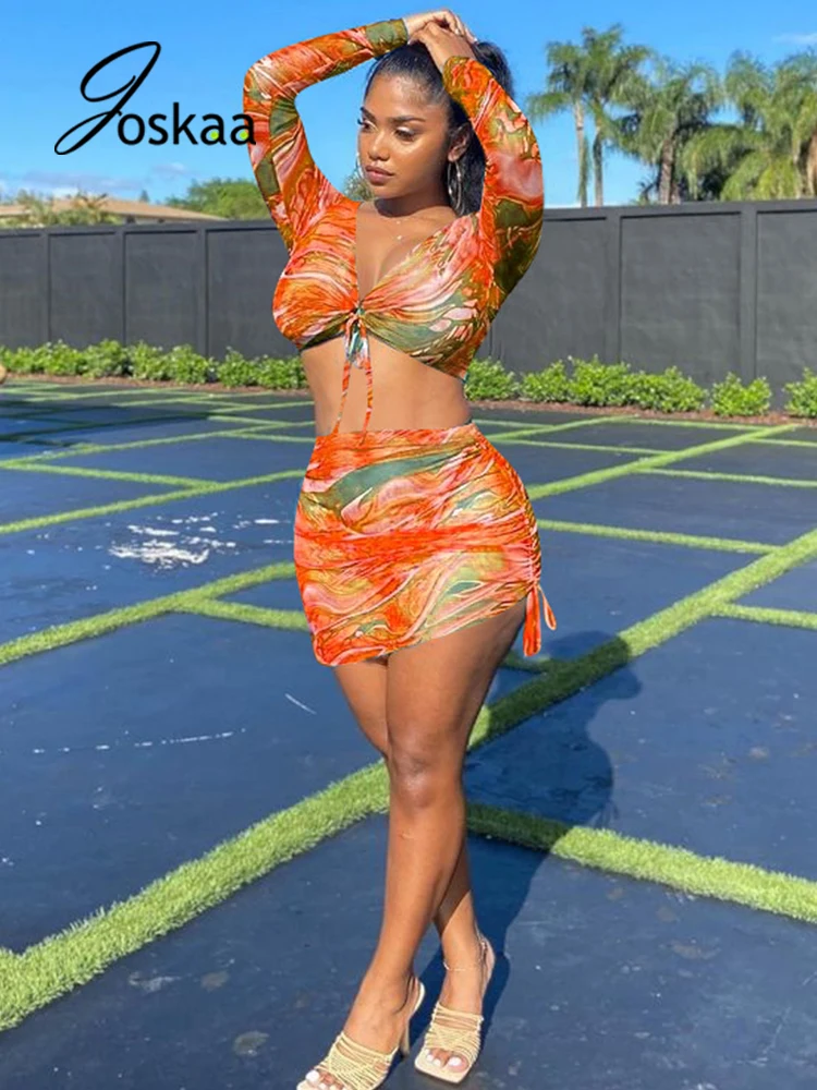 

Joskaa Summer Mesh Printed Beach Suits Sexy Long Sleeve Crop Top+Bandage Bodycon Mini Skirt 2 Pcs Sets Club Outfits For Women