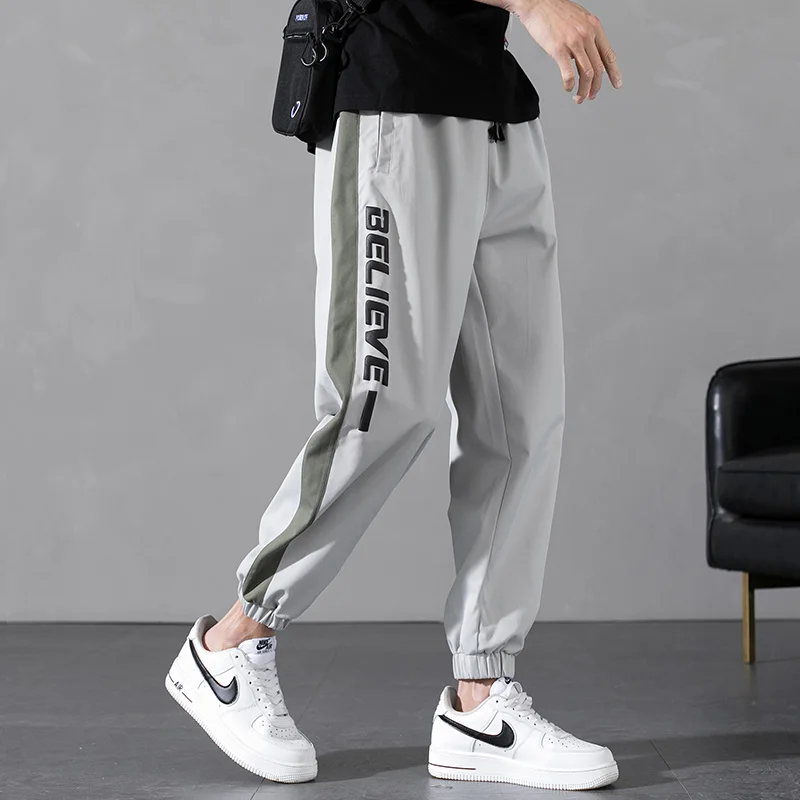

Spring New Men Joggers Pants Male Loose Casual Striped Harem Trousers Mens Sportswear Sweatpants Letter Print Hip Hop Streetwear