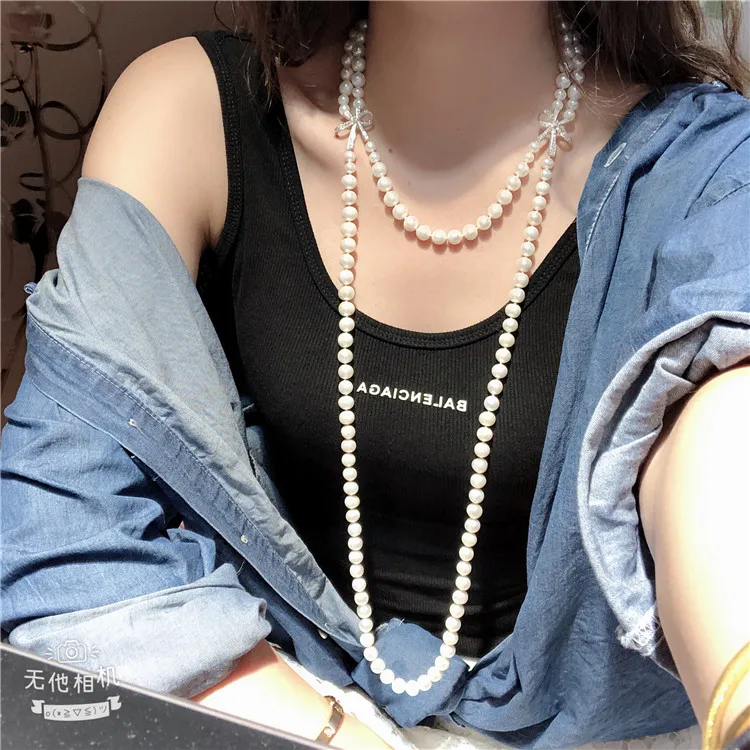 

Hand knotted natural white freshwater pearl fashion long double necklace sweater chain butterfly micro inlay zircon accessories