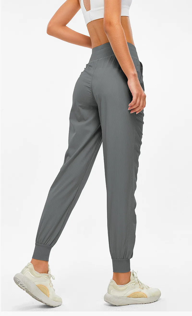 Women Sport Pants Fitness Yoga Legging Natural Folds Quick-drying And Breathable Drawstring Feet Loose Trousers With Pocket