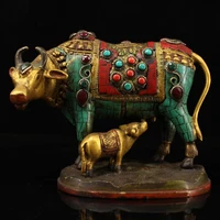 tibetan collection of old tibetan craftsmanship hand made inlaid gemstones painted gold depicting mother and child cow statue
