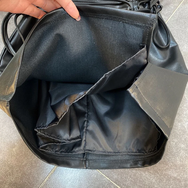 

VGH Black PU Leather Skirt For Women High Waist Lace Up Bowknot Midi Bodycon Skirts Female Summer Fashion Clothing 2021 Tide New