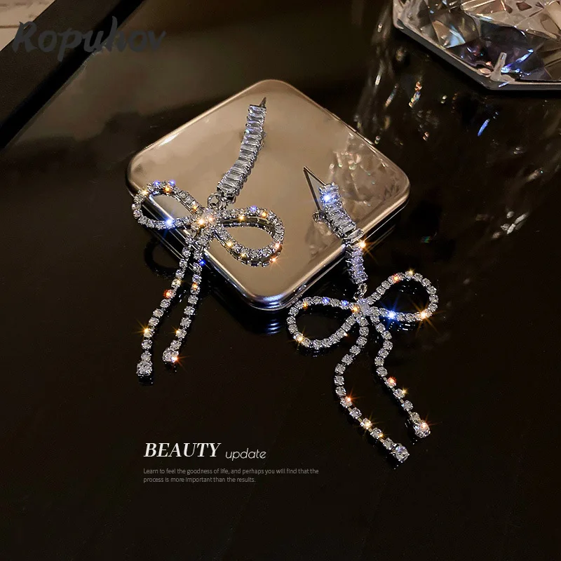 

Серьги-кисточки Ropuhov из серебра 925 пробы с инкрустированными бриллиантами и бантом из циркония