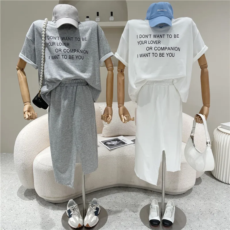 

Two Piece Set Women Summer 2021 Niche Design Fashion Loose Round Neck Short Sleeve T-shirt + High Waist A-line Irregular Skirt