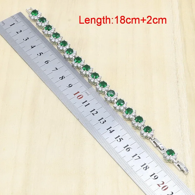 Женский ювелирный комплект из колье серёг и браслета серебристого