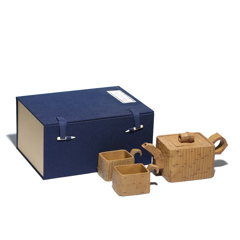 

Yixing Zisha HUNI Xin'an zhupiantao formation one pot two cups teapot wholesale raw ore mud