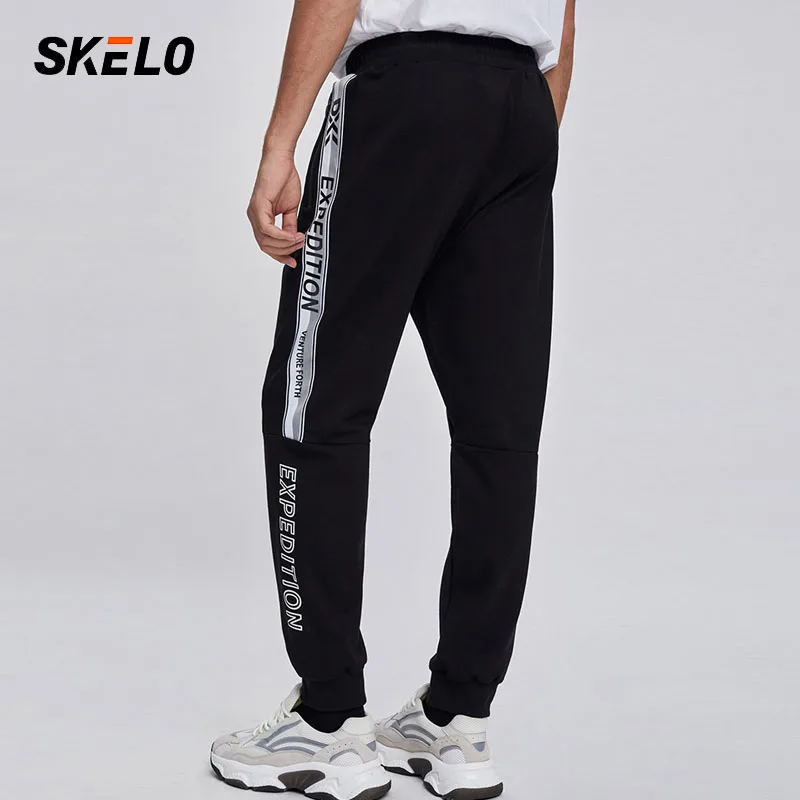 Леггинсы мужские спортивные с карманами эластичные свободные для бега 2021