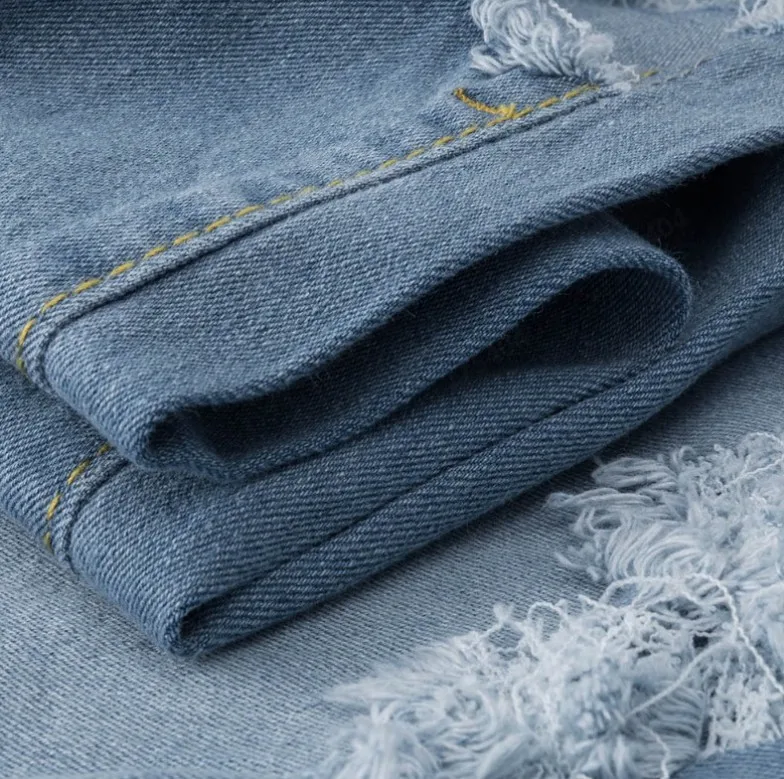 

New European and American style women's high-waisted buttocks elastic ripped jeans