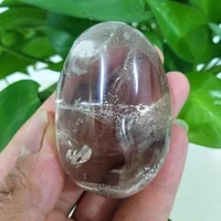 a natural quartz crystal palm stone with rainbow yoga practice plaything chakra healing crystals