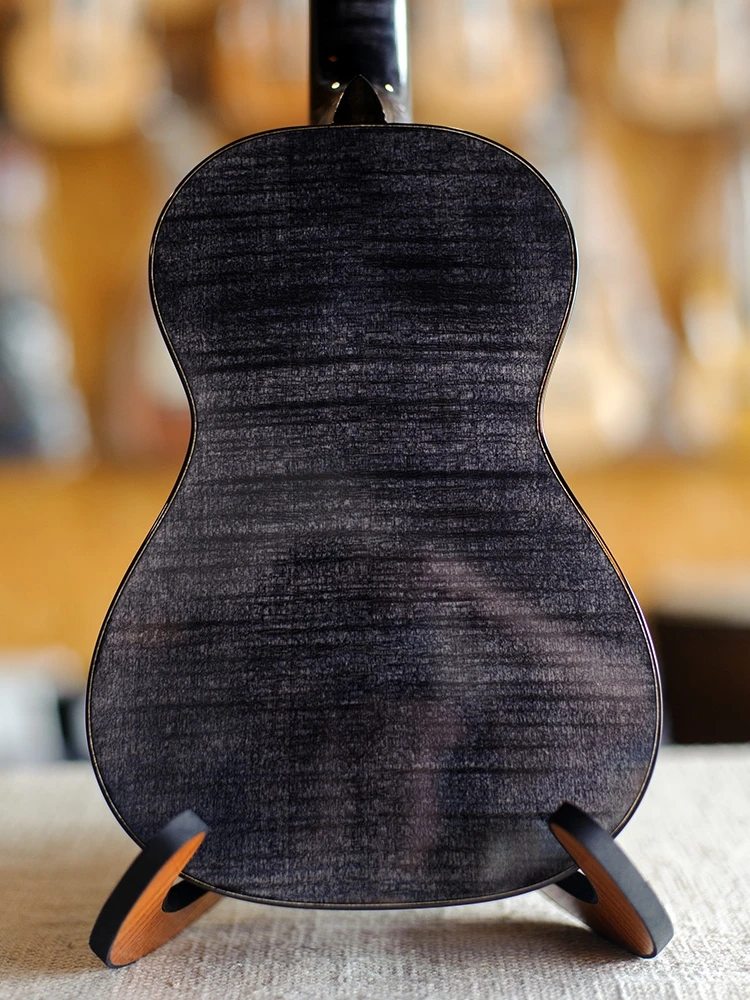 

Malaysia Rainie Yeying 23 inch European Maple veneer Hawaiian four string guitar