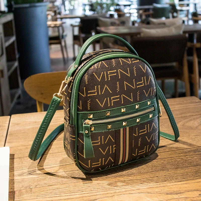 

Backpack female 2021 spring girl bag trend rivet super fire school bag all-match small backpack