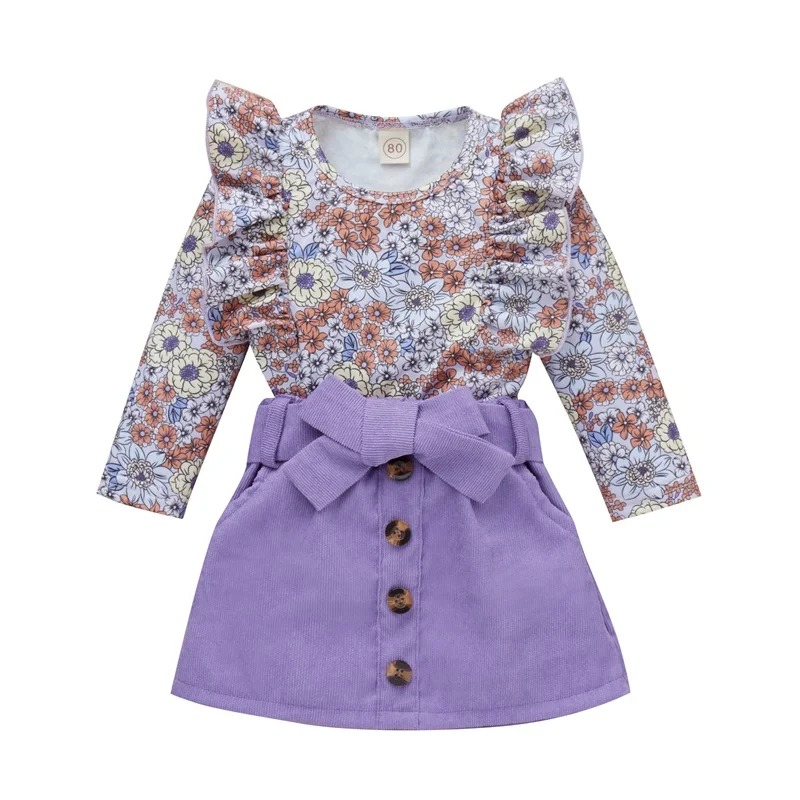 

Комплект для маленьких девочек из 2 предметов, кружевные топы с длинным рукавом и круглым вырезом и цветочным принтом + короткая юбка на пуго...