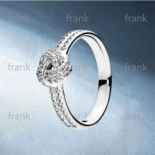 

190997CZ SPARKLING LOVE KNOT FEATURE RING