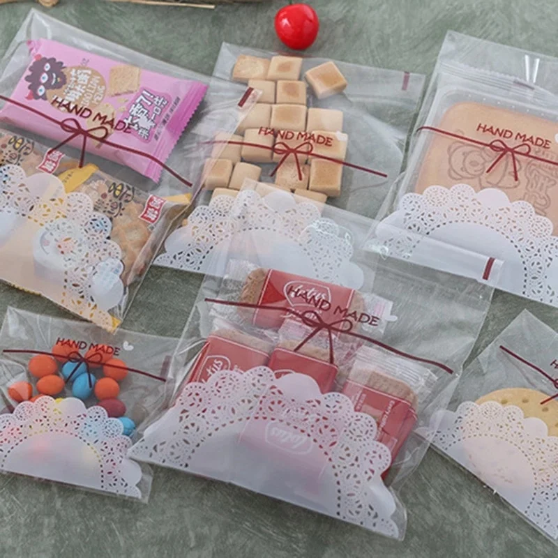 

100Pcs/lot 7x7cm 10x10cm Cute Lace Bow Print Self-adhesive Gifts Bags Wedding Party Cookie Packaging for Biscuits Candy Cake