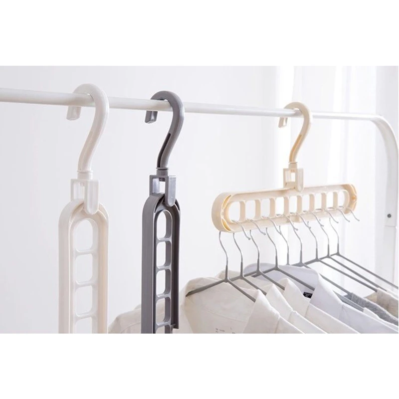 

Space saving 9 holes 360 degree rotating magic hanger multi-purpose folding clothes hanger wardrobe clothes clothes storag