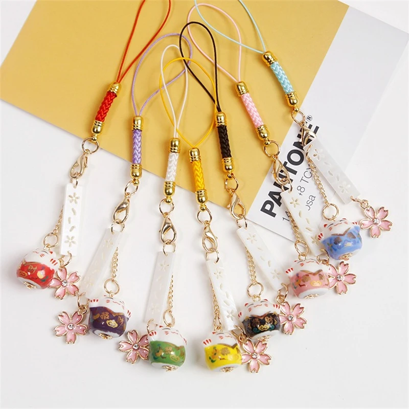 

Ins Japanese Cute Mascot Cherry Blossom Praying For Good Luck Cat Mobile Phone Car Pendant Women Anti-Lost Lanyard Jewelry Gifts