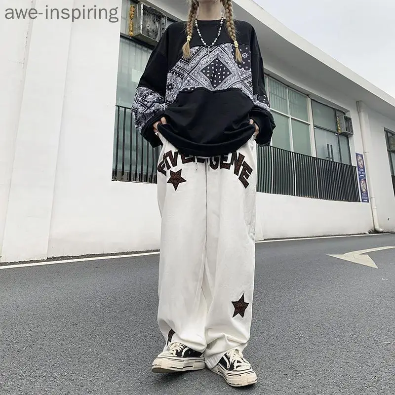 

Оригинальные Осенние трендовые повседневные брюки с вышивкой для мужчин и женщин, модные уличные свободные брюки в стиле ретро с леопардов...