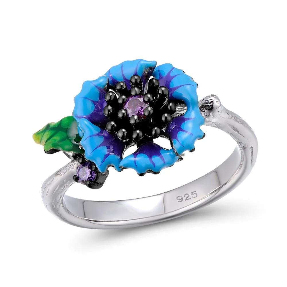 Женский ювелирный комплект из колье серёг и кольца с синей маргариткой |