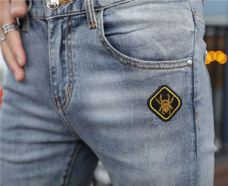 

European Station 2021 new jeans for men with embroidery holes micro elastic popular logo fashion slim slim feet men pants trend