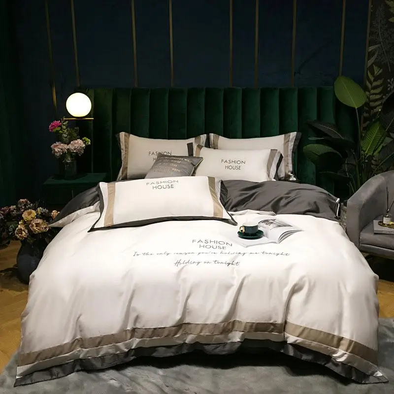 Комплект постельного белья из египетского хлопка высокого качества с вышивкой, сатиновым блеском и легким роскошным дизайном, включающий наволочки и простыню.