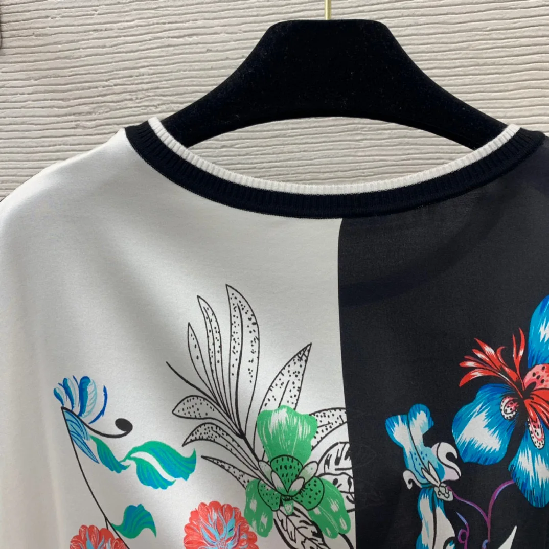 

High-quality fashion women's tops and T-shirts. Runway. Luxury European style design. Short version. Party style women