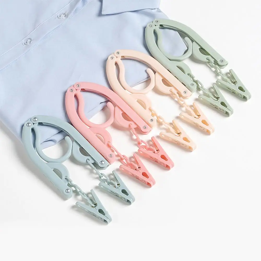 Travel clothes hanger Portable Folding Clothes Hanger Multifunction Magic Stretch Drying Rack Home Wardrobe Storage | Дом и сад