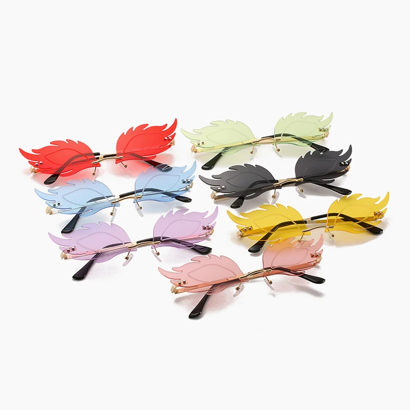 

Luxury Fashion Flame Feather Sunglasses Ladies Frameless Fish Sunglasses Retro Ladies Metal Glasses UV400 Ocean Tablets
