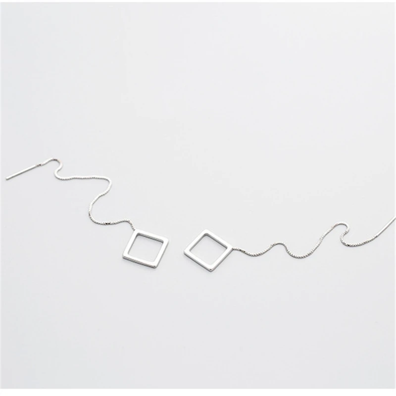 Женские серьги-подвески серебряного цвета длинные треугольные квадратные