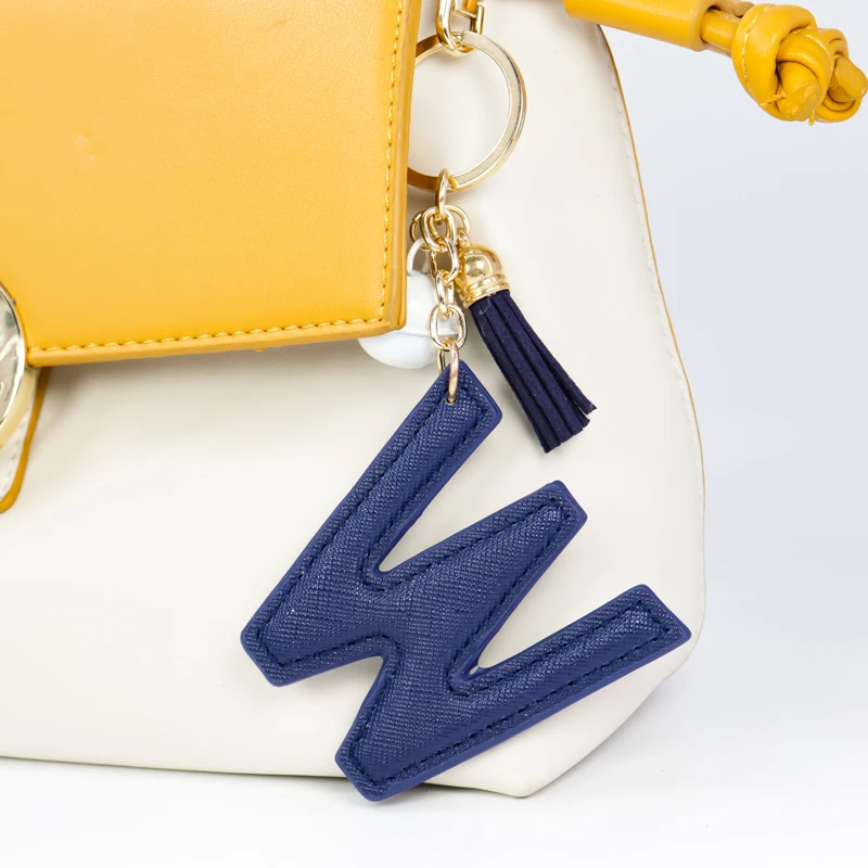 

Multicolor English alphabet keychain PU leather material alloy bell flannel tassel bag key chain pendant creative small gift