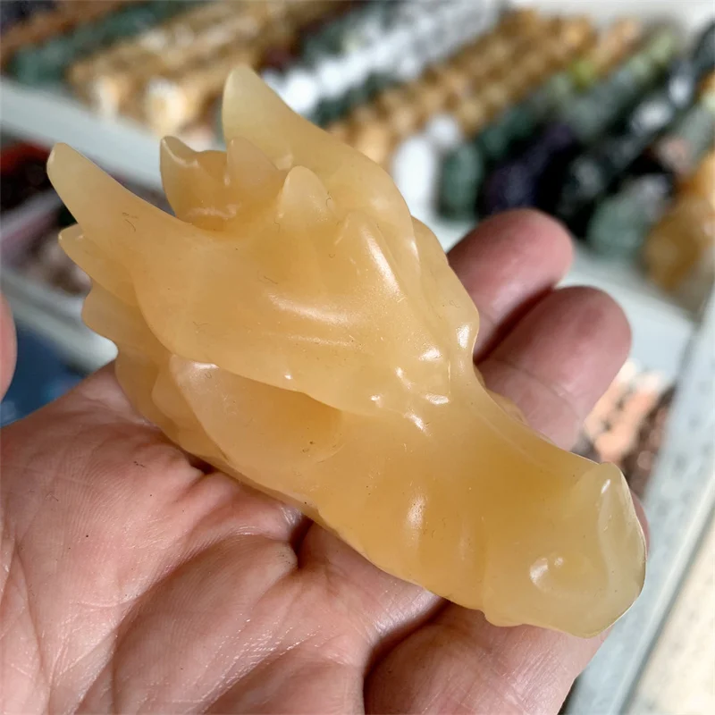 

Crystal Dragon Head Skull Statue Natural Orange Calcite Stone Crystal Carved Decor