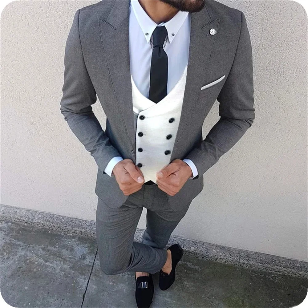 

Новый высококачественный индивидуальный серый пиковый отворот мужской костюм свадебный двубортный белый жилет приталенный смокинг 3 пред...