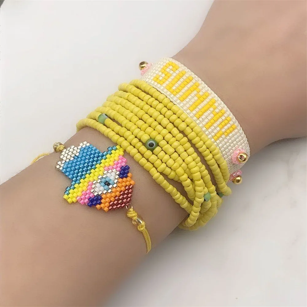 Женский браслет с кисточками желтый надписью Evil Eye желтым бисером ювелирное