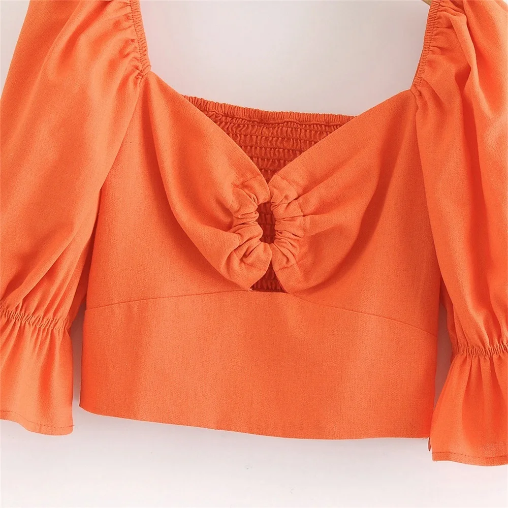 

2020 summer women's new French triangle V-neck low-cut slim slimming hollow short puff sleeve sexy exposed navel shirt