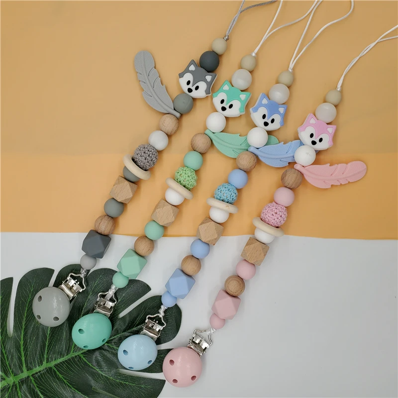 

Baby Pacifier Clip Holder Wooden Beads Silicone Dummy Holder Cartoon Feather Nipple Chain Bebe Teether For Teeth Teething Chain